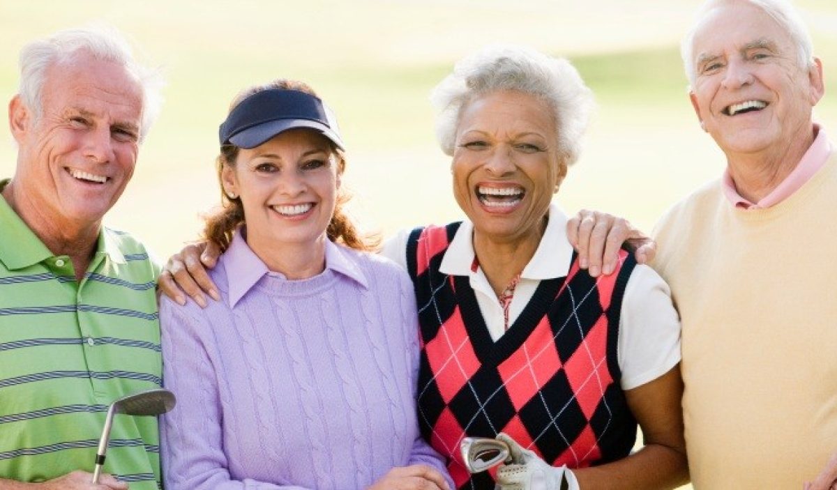 Portrait Of Four Friends Enjoying A Game Golf